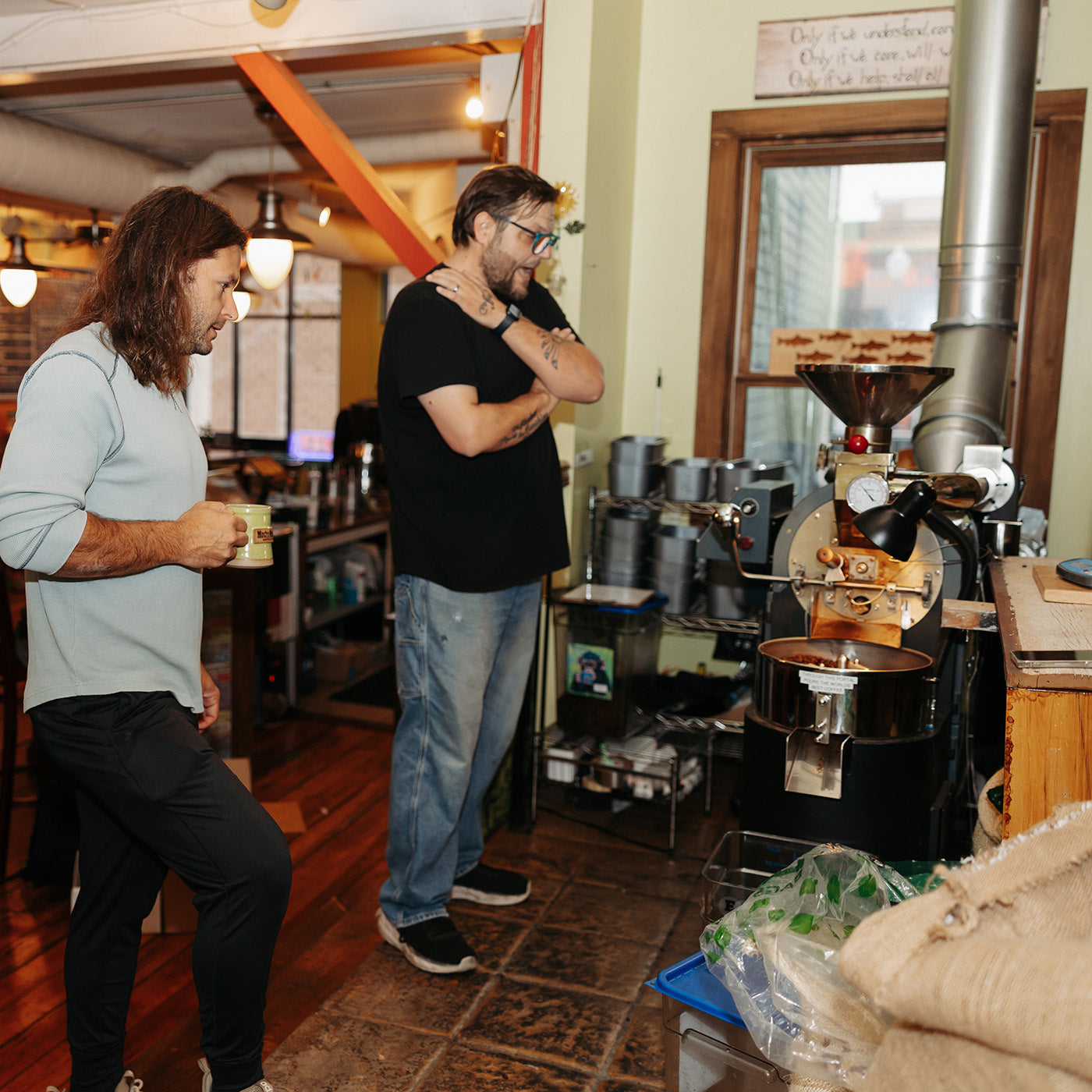 Jon Schmidt and Jon Pennucci standing by a coffee roaster