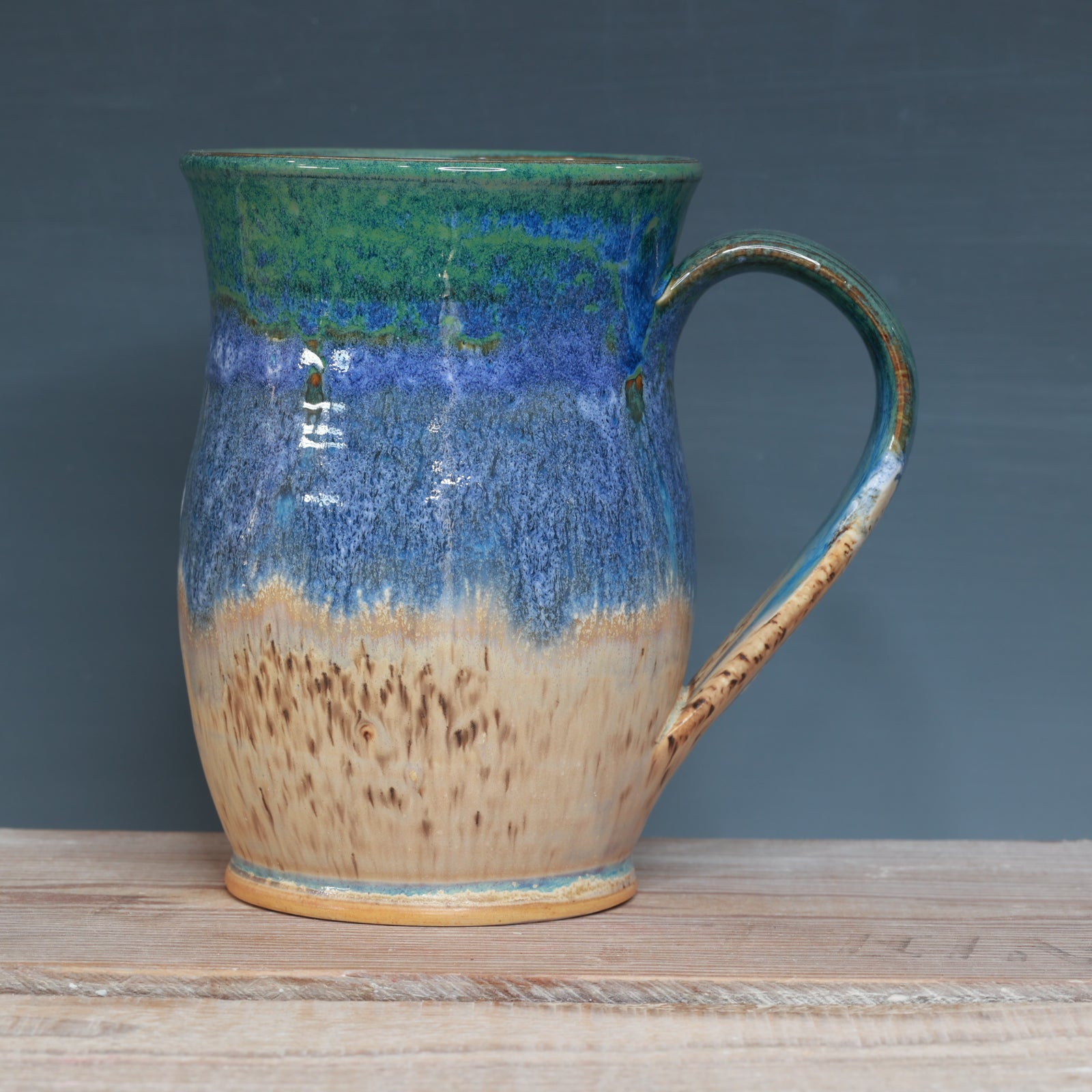 Blue surf and Sandstone Beach 20-21oz