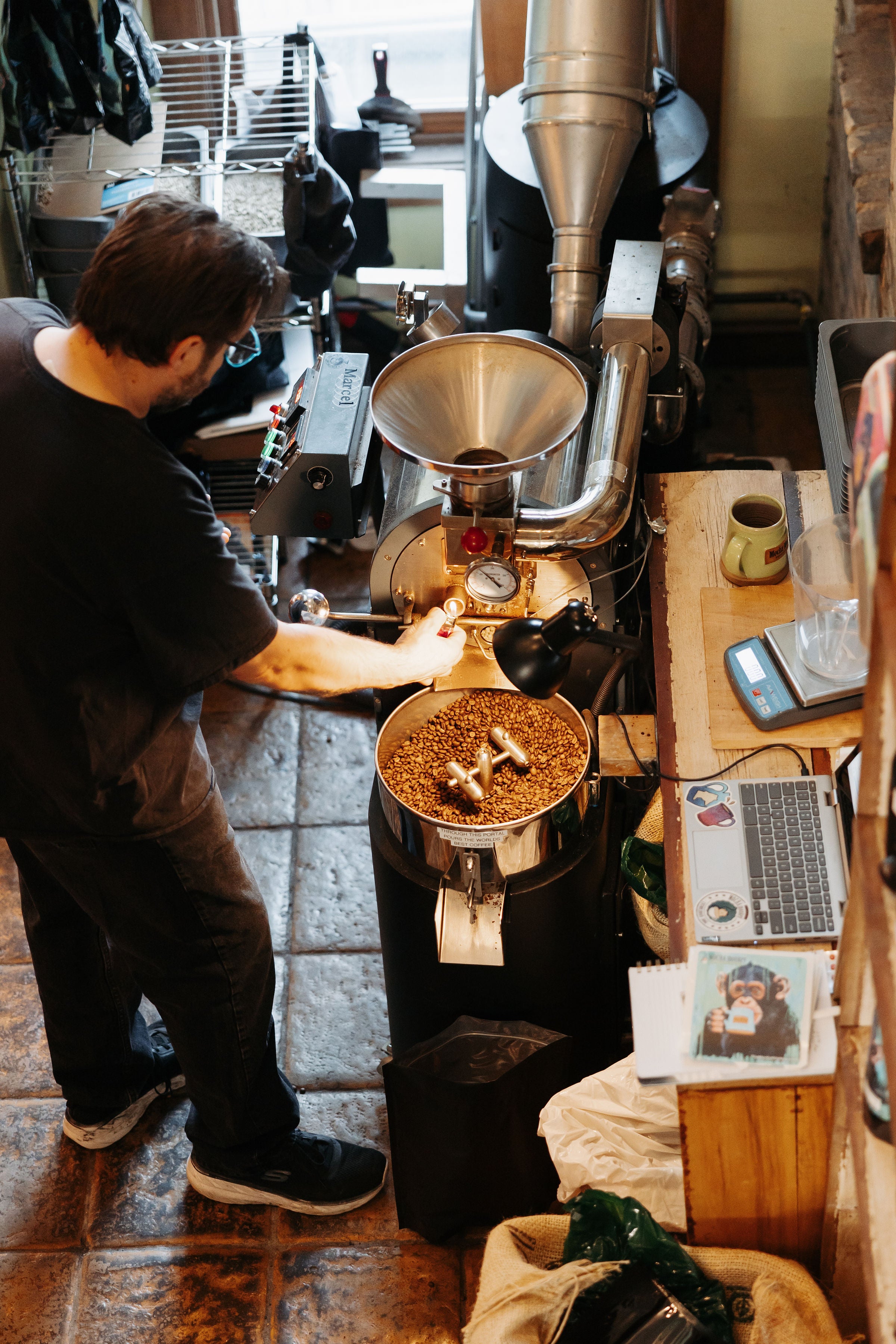 Overhead shot of John Pennucci roasting coffee.