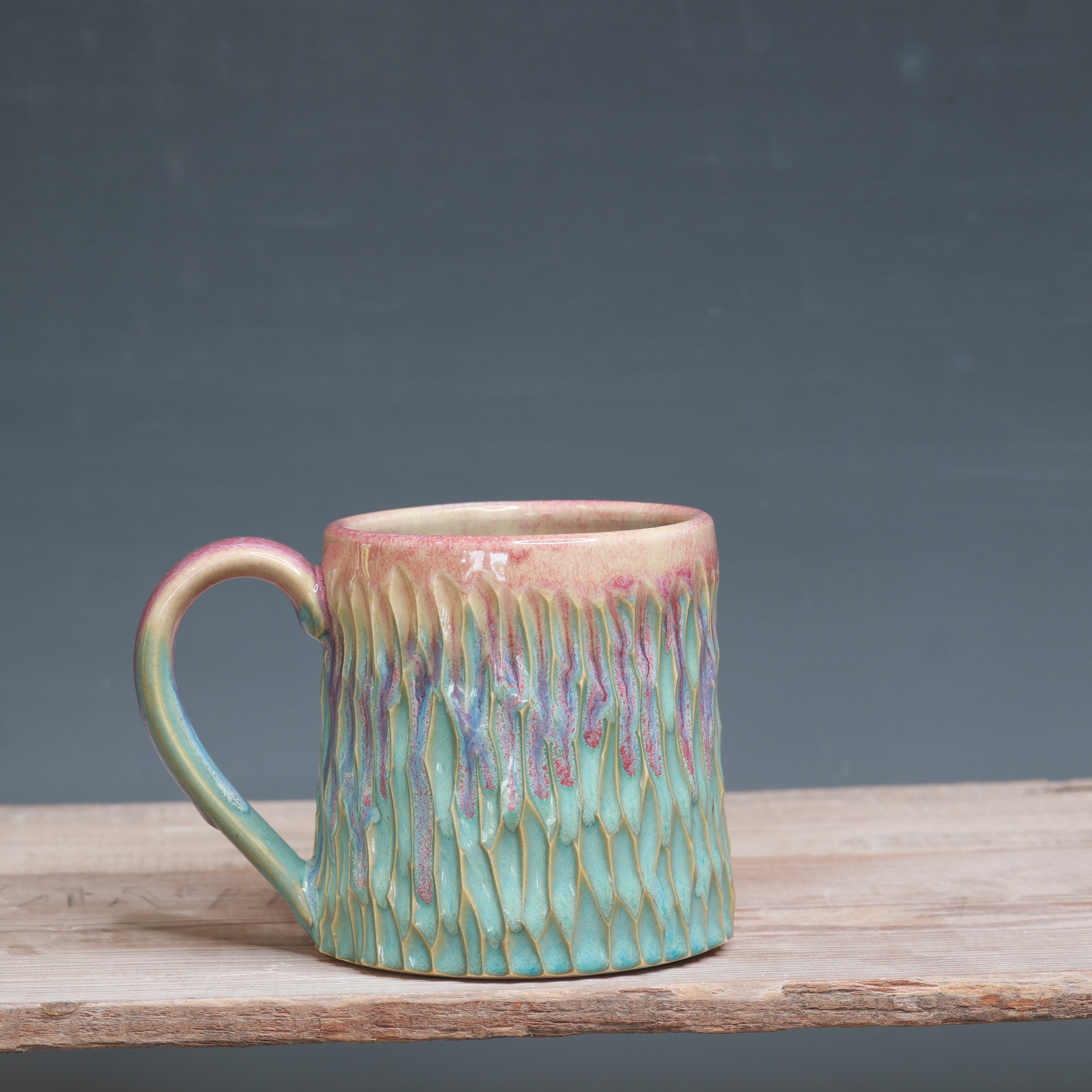 Raspberry Mist over Norse Blue Carved mug 10-12 oz.