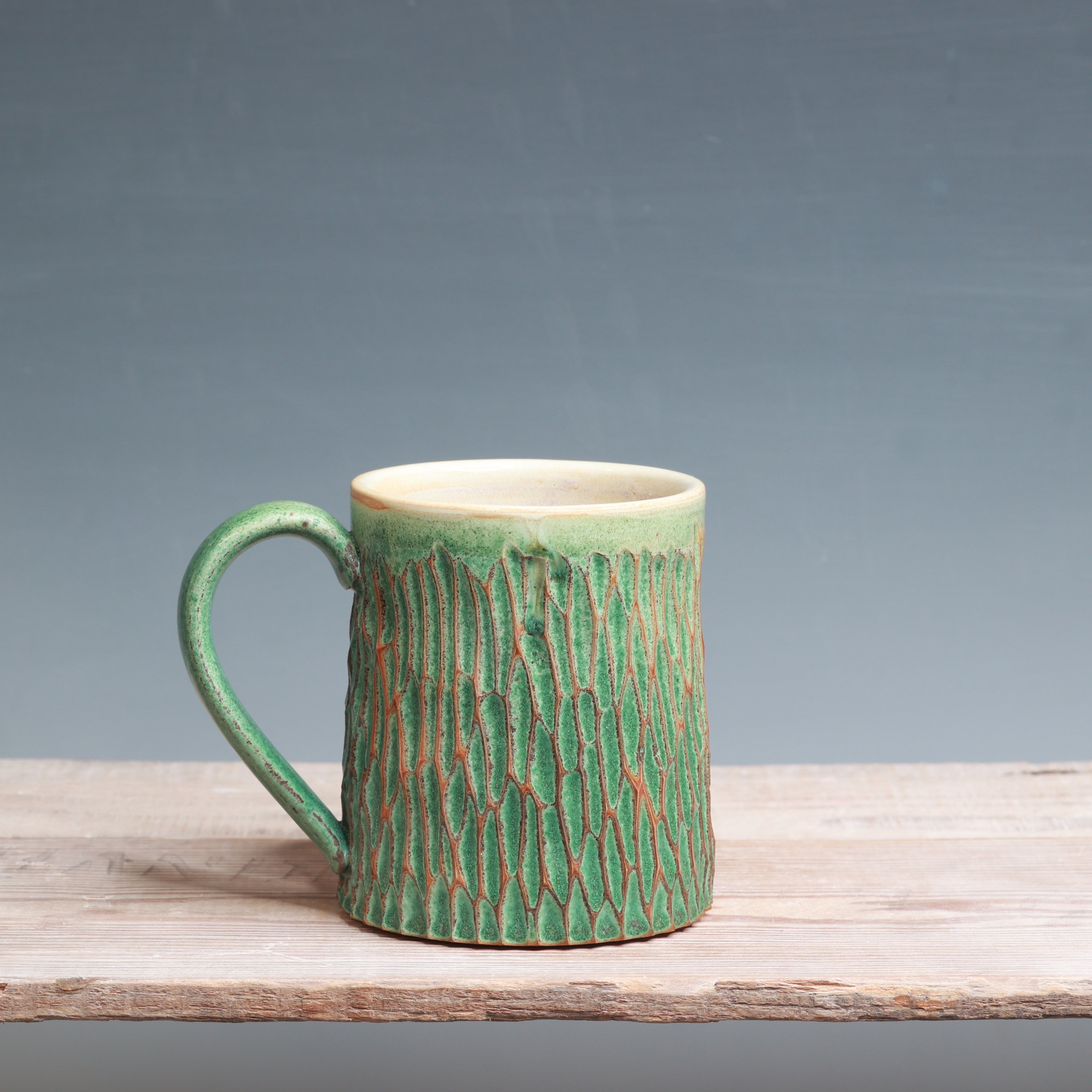 Satin Patina Carved mug 13-14 oz.