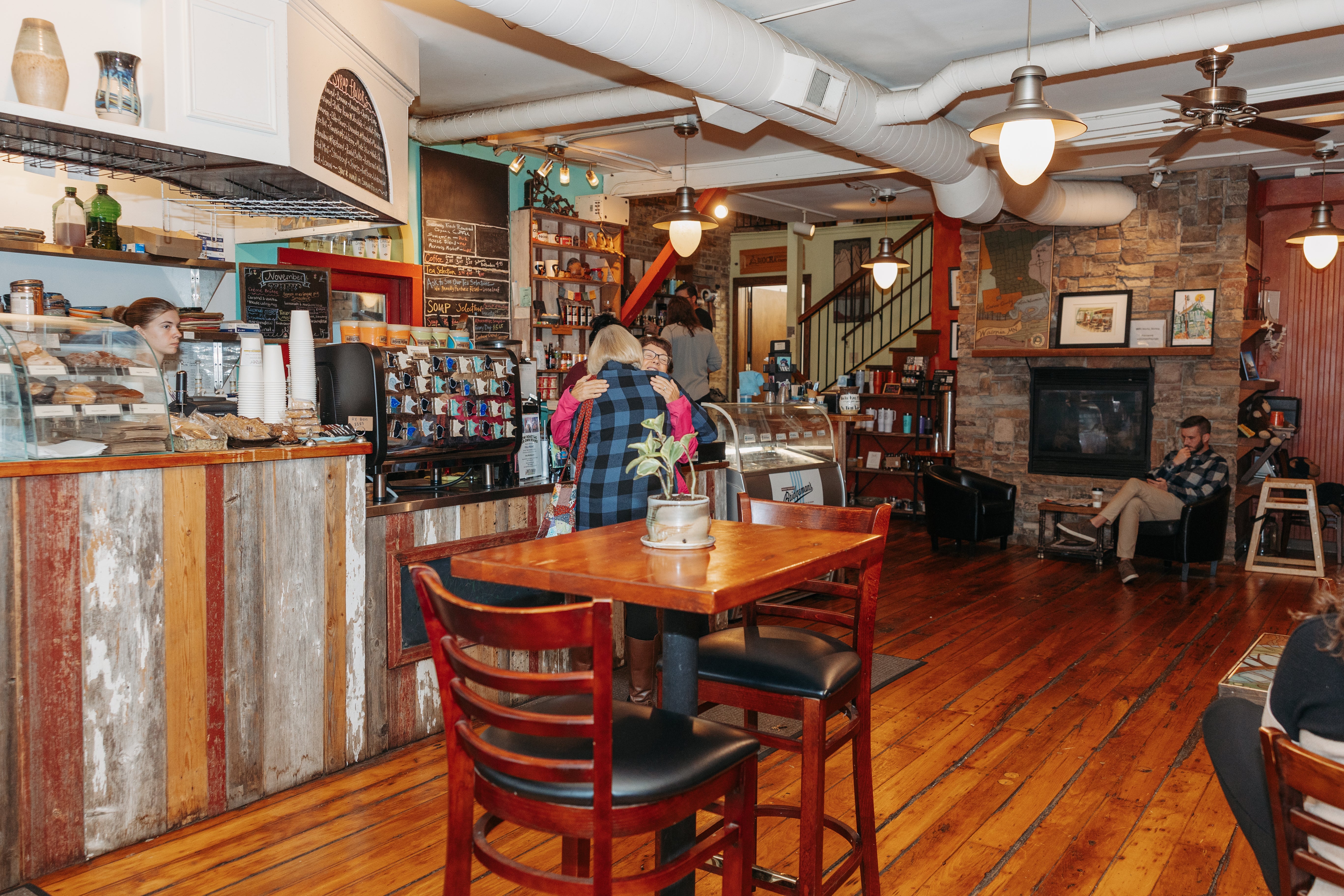 Two women hugging at the Downtown Waconia Mocha Monkey