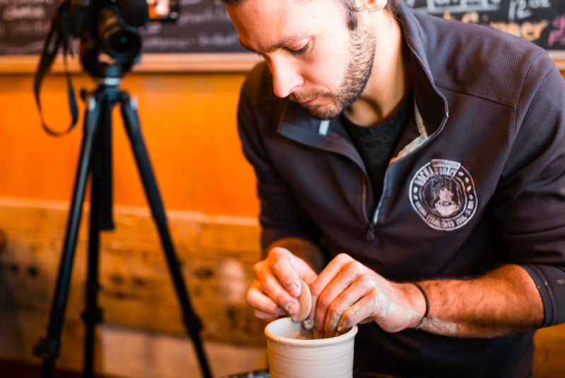 Jon finishing a handmade mug