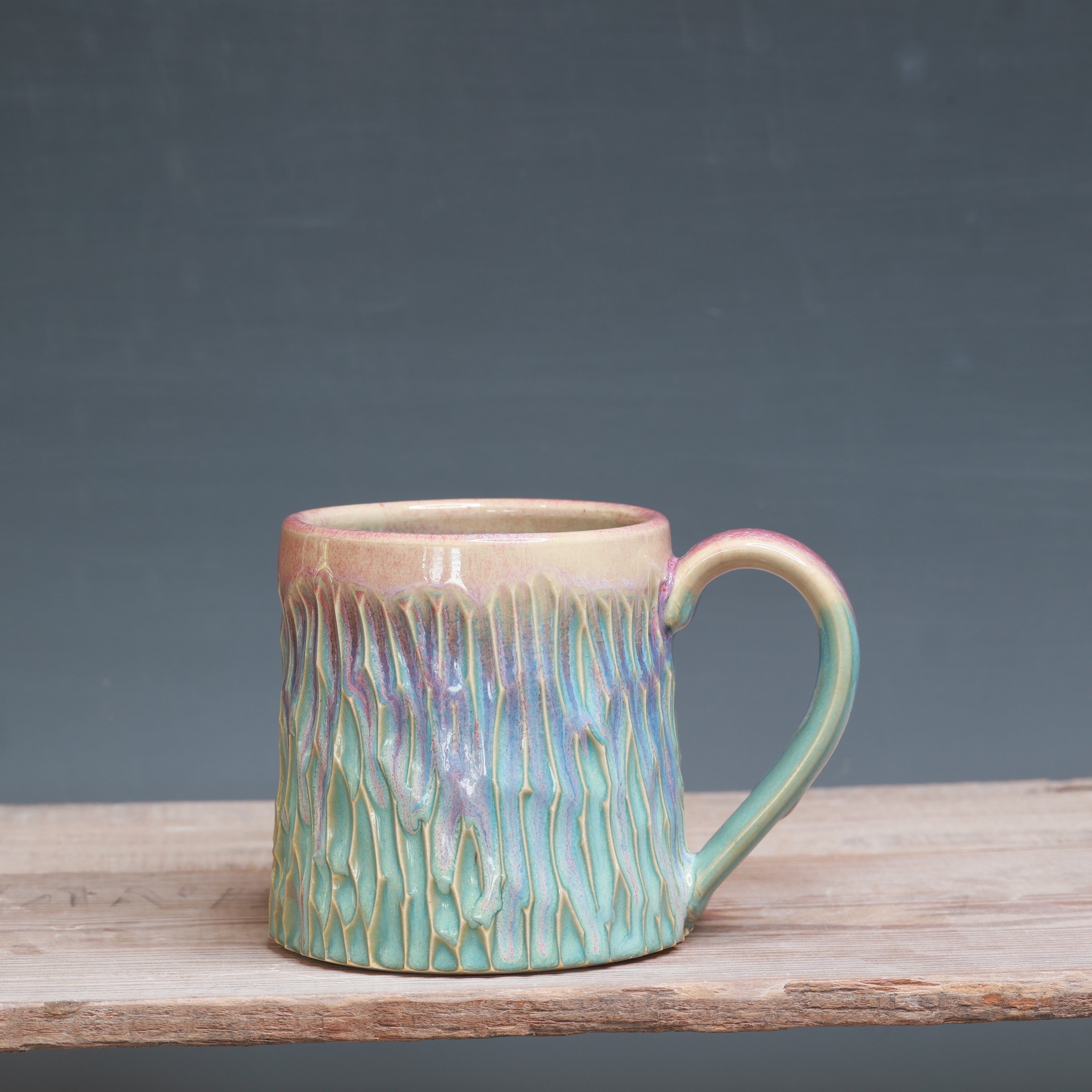 Raspberry Mist over Norse Blue Carved mug 10-12 oz.
