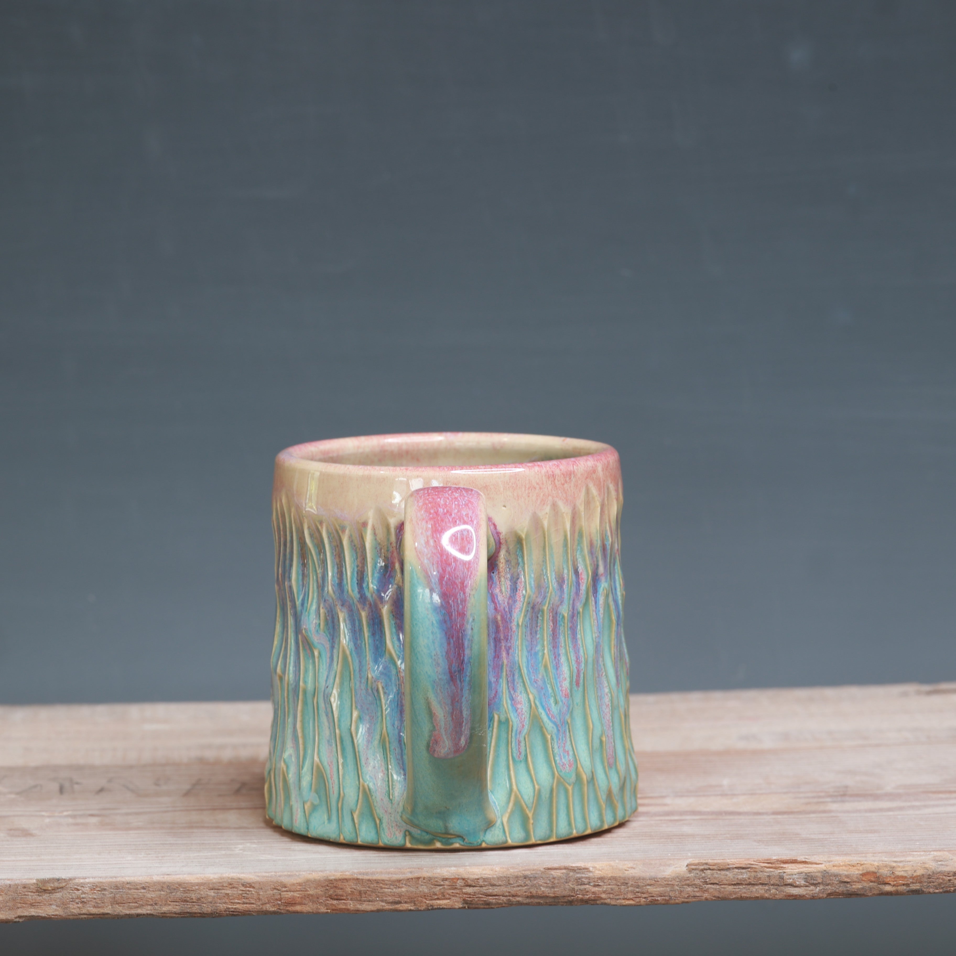Raspberry Mist over Norse Blue Carved mug 10-12 oz.