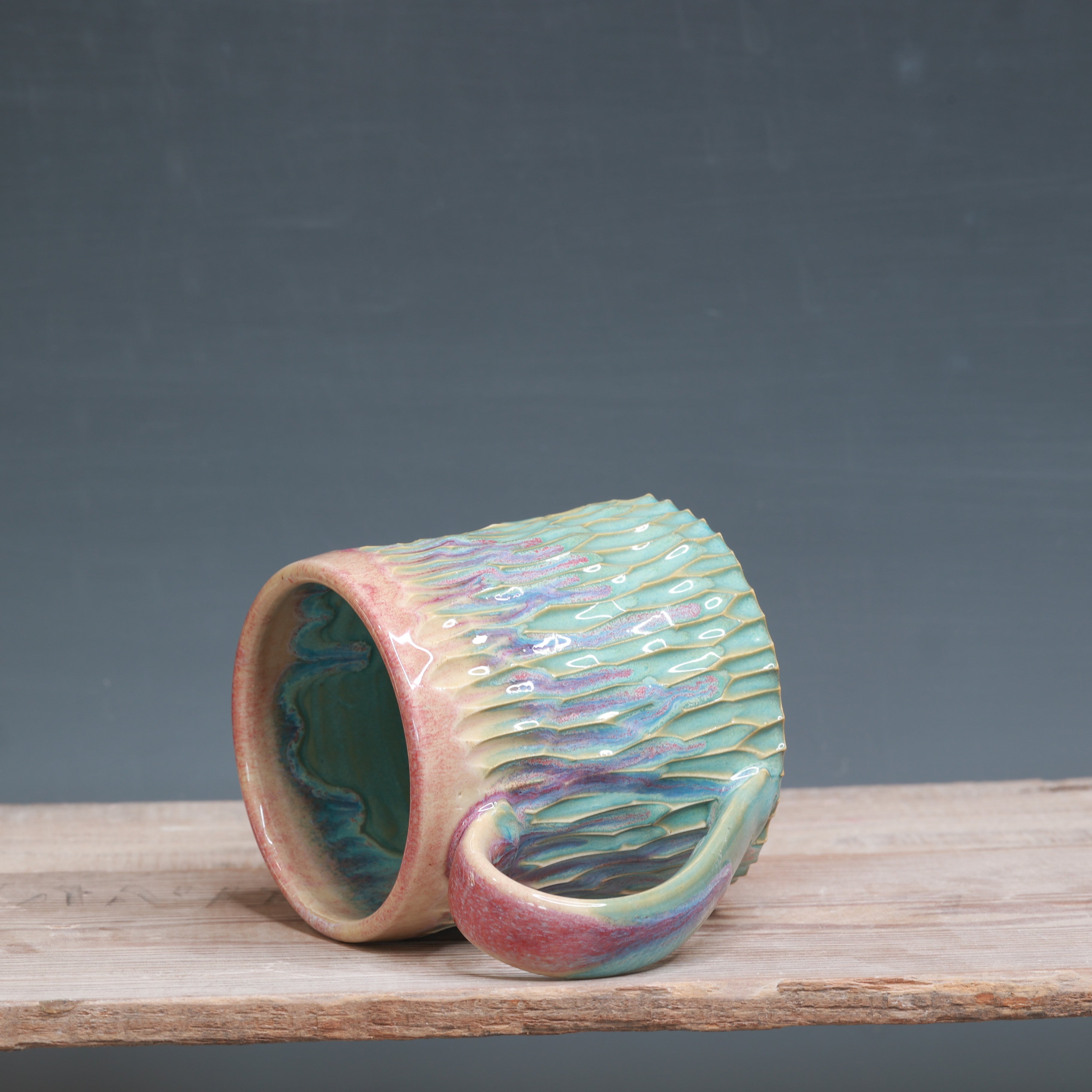 Raspberry Mist over Norse Blue Carved mug 10-12 oz.