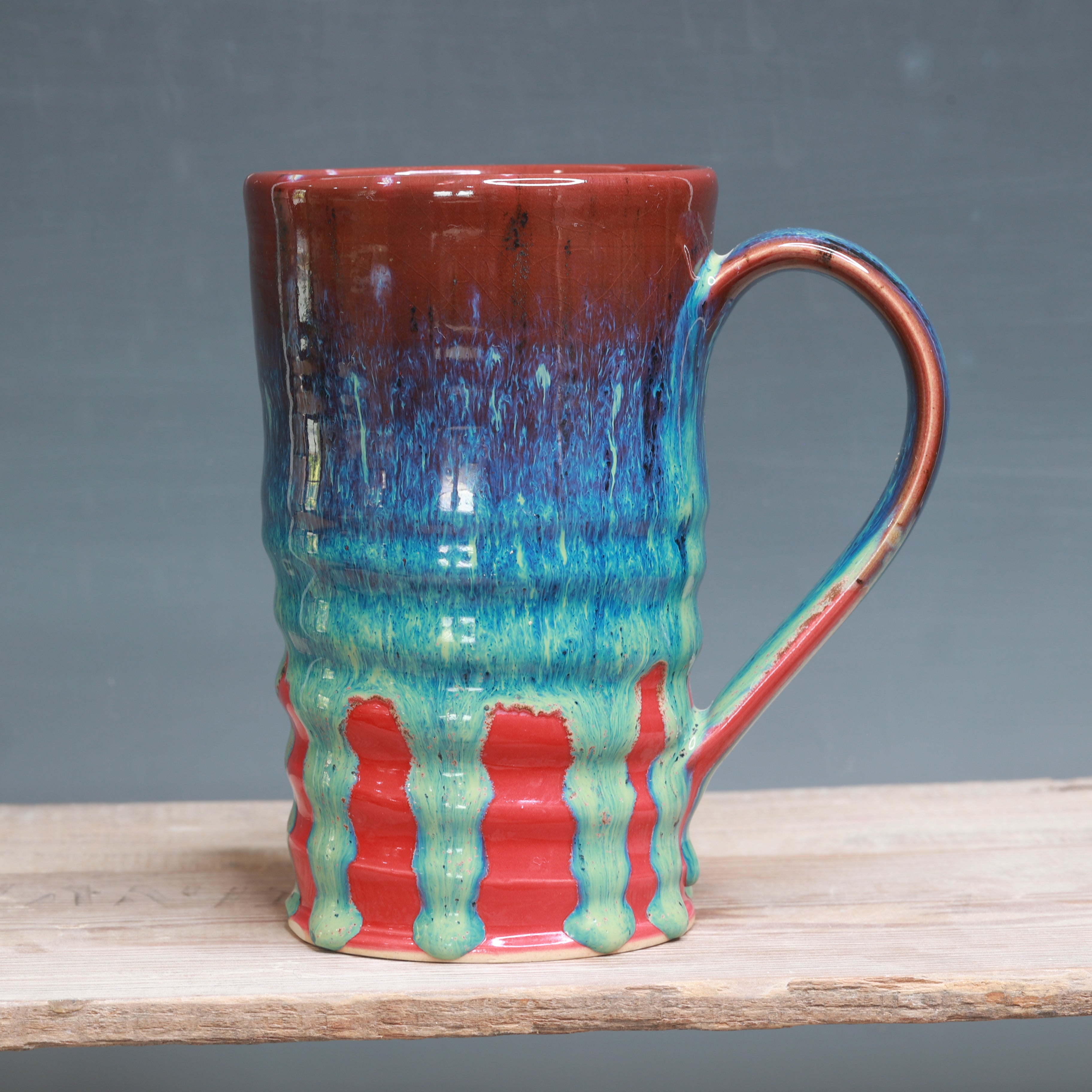 Aurora Green over Red mug 25-27 oz.